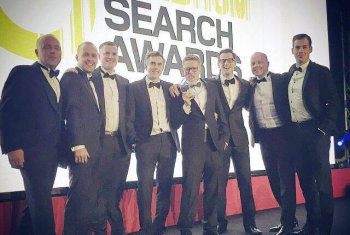 The SEO Works team at The Drum Search Awards with winner trophy
